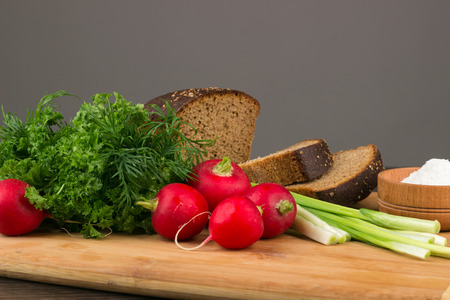Healthy vegetarian food. Radishes, parsley, green onionsの写真素材