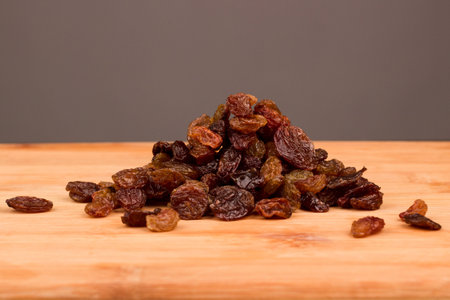 Raisins on a wooden surface. Healthy nutrition and dietの写真素材
