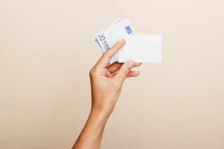 female hand holding euro bills
