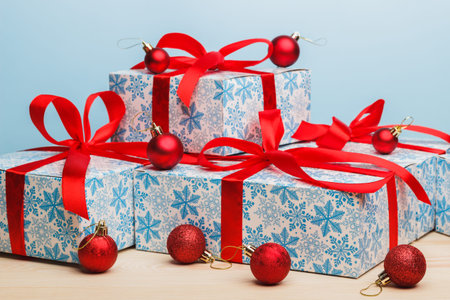 Cristmas gifts with red ribbons and red balls