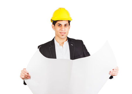 Young man in a construction helmet with an architectural drawing in his hand, isolated