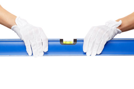 A blue construction level in the hands, isolated