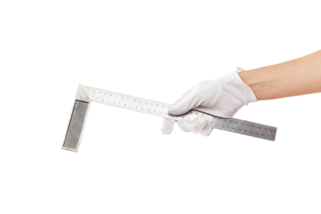A metal straightedge in the hand, isolatedの写真素材