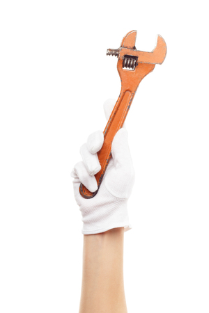 Metal monkey wrench in the hand, isolatedの写真素材