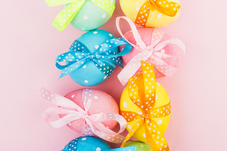 Colorful Easter eggs with decoration, pink backgroundの写真素材