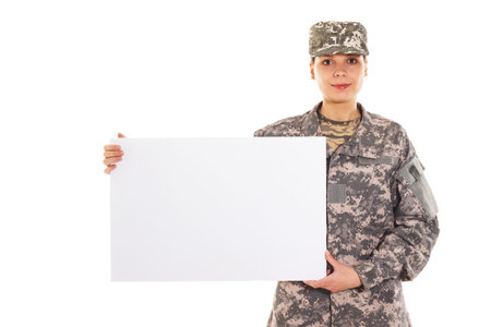 Portrait of soldier in the military uniform with plate, isolated