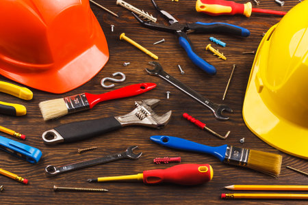 Background made from different construction tools on the wooden boardの写真素材