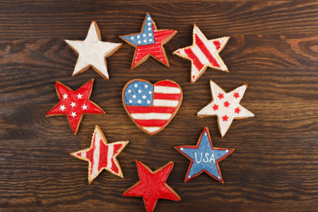 Different shapes cookies with American patriotic colors on the wooden backgroundの写真素材