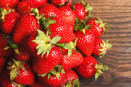 Bunch of Red strawberries on the wooden background