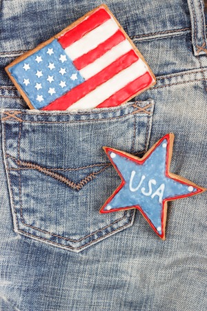 Flag shaped cookie with American patriotic colors in the denim's pocket and starの写真素材