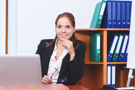 Business woman working in the office, soft focus backgroundの写真素材
