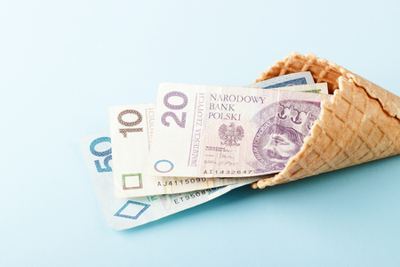 Monetary signs: Polish zloty on a blue paper background and beautiful packagingの写真素材