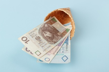 Monetary signs: Polish zloty on a blue paper background and beautiful packagingの写真素材