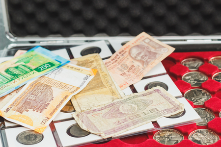 Different Indonesian rupiahs and coins numismatics concept, blurred backgroundの写真素材