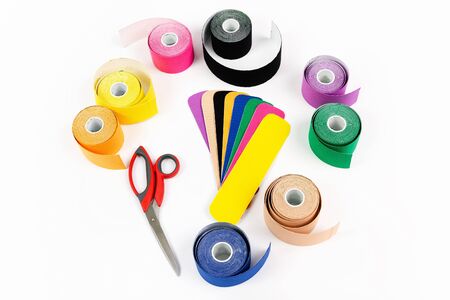 Colored kinesio tape with scissors, on a white background. Isolatedの写真素材