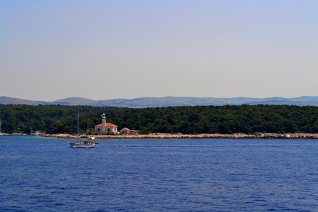 Little lighthouse on the sea shoreの写真素材