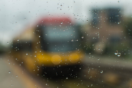 Tram behind a glass in a rainy dayの写真素材