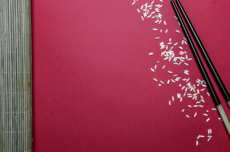 Bamboo chopsticks, border red background with copy spaceの写真素材