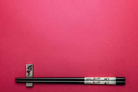 Bamboo chopsticks, border red background with copy spaceの写真素材