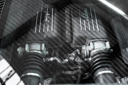 Close up through the car window of McLaren engine.