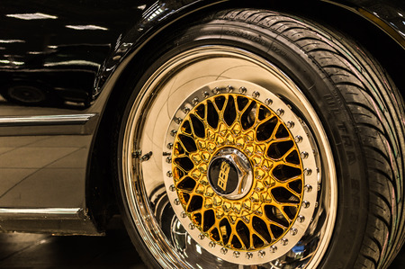 BBS logo close up on a chrome golden luxury car rimsのeditorial素材