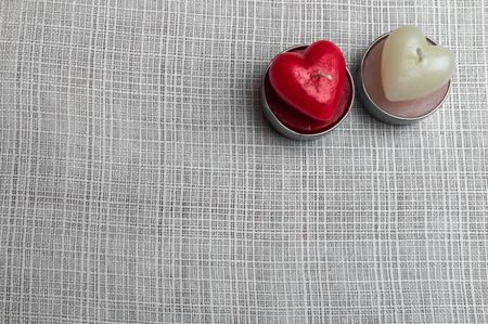 Red and white heart candles on white background materialの写真素材