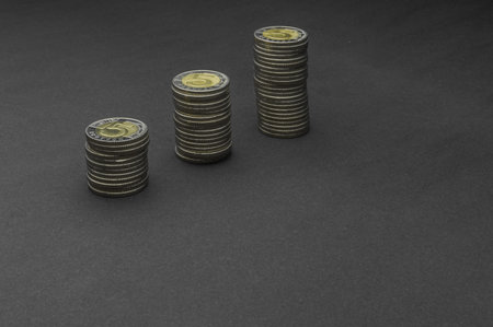 Stack of coins on dark background (Five Polish Zloty coins) - business concept
