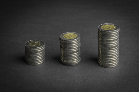 Stack of coins on dark background (Five Polish Zloty coins) - business conceptの写真素材
