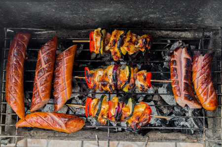 Preparing a meal on a grillの写真素材