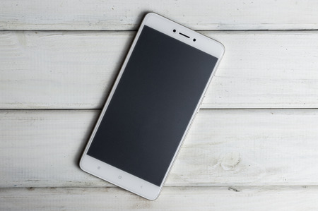 Smartphone on wooden backgroundの写真素材