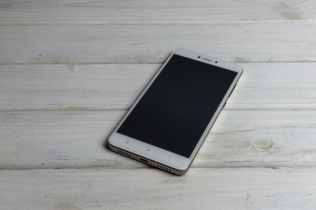 Smartphone on wooden backgroundの写真素材