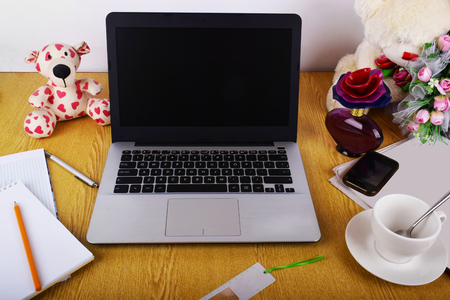 Mock up objects such as computer, smartphone on a wooden background, front viewの写真素材