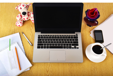 Mock up objects such as computer, smartphone on a wooden background, front viewの写真素材