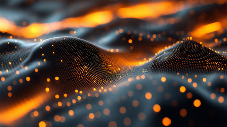 This striking image depicts a mesmerizing landscape of luminous nanoparticles interacting with one another. The particles appear to be suspended in a dynamic, undulating motion, creating a visually captivating and almost hypnotic effect. The warm, golden hues of the particles contrast beautifully with the dark, ethereal background, giving the scene a sense of depth and mystery.の写真素材