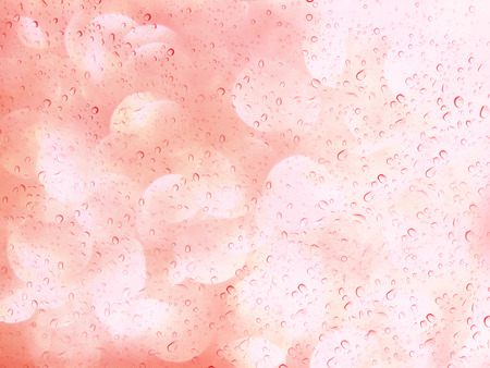 Romantic pastel bokeh and water drop on glass mirror plate abstract valentine backgroundの写真素材