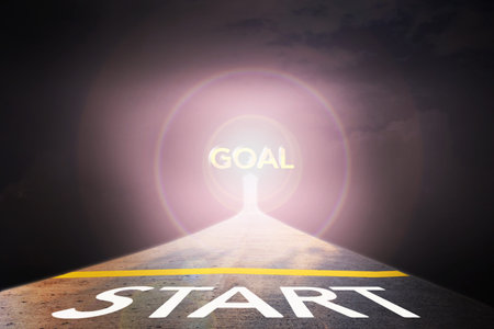 Business concept way to success with text goal in sunlight and start on the road with dark...