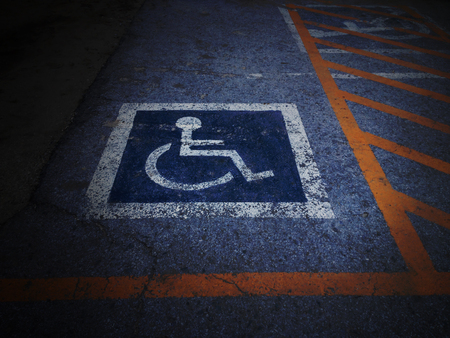 Wheel chair car park symbol on old grunge floor in darkの写真素材