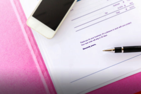 Pen on invoice and products shipping document selectived focus at pen and sincerely yours