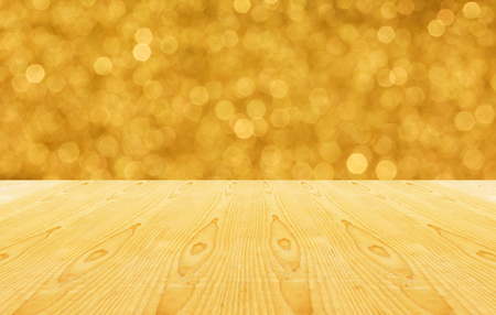 Blank area or space table top on golden luxury bokeh sparkle glow light backgroundの写真素材