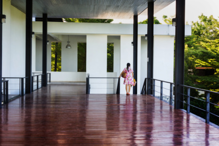 Blurred background wooden floor in airly or open lobby in modern buildingの写真素材