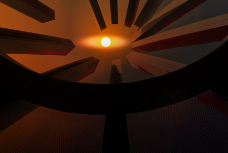 View of look up trough gap or cavity on roof with sun on twilight sky, abstract eyes from sun watching, someone or god watching from skyの写真素材