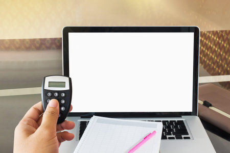 Hand hold token to generate password for online banking with blank screen notebook or computer  for...