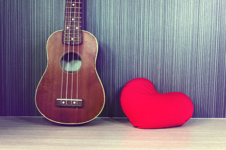 Vintage classic ukulele with red heart and blank area or spaceの写真素材