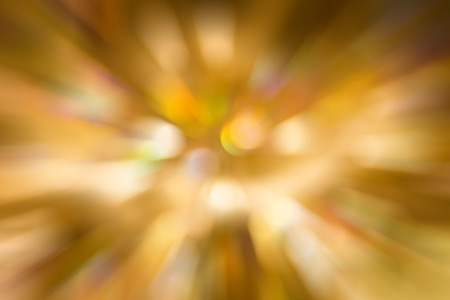 Abstract background zoom to center golden bokeh lightの写真素材