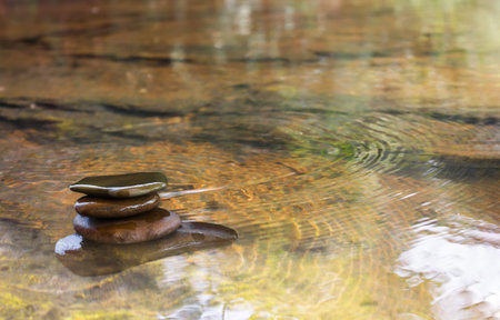 Pebble or balance stone in water furface nature backgroundの写真素材