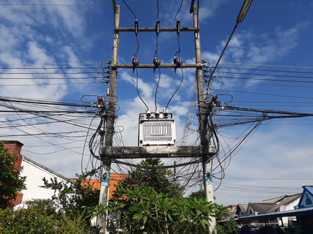 Electric transformer or autotransformer with cable wire at electric postの写真素材