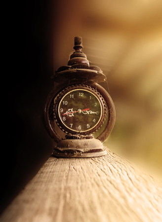 Old vintage clock with cobweb or gossamer in sepia old toneの写真素材