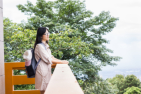 Blurred background women at balcony looking to high top view of mountain nature backgroundの写真素材
