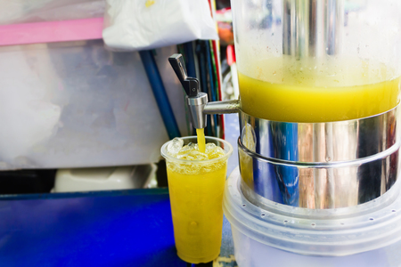 Sugar cane pour in to plastic glass, cool fresh fruit juiceの写真素材