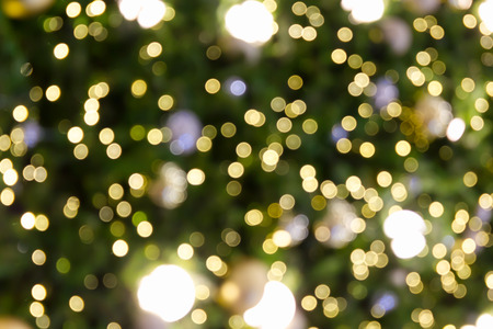Bokeh green and yellow light background for Xmas, Christmas or New Year backgroundの写真素材